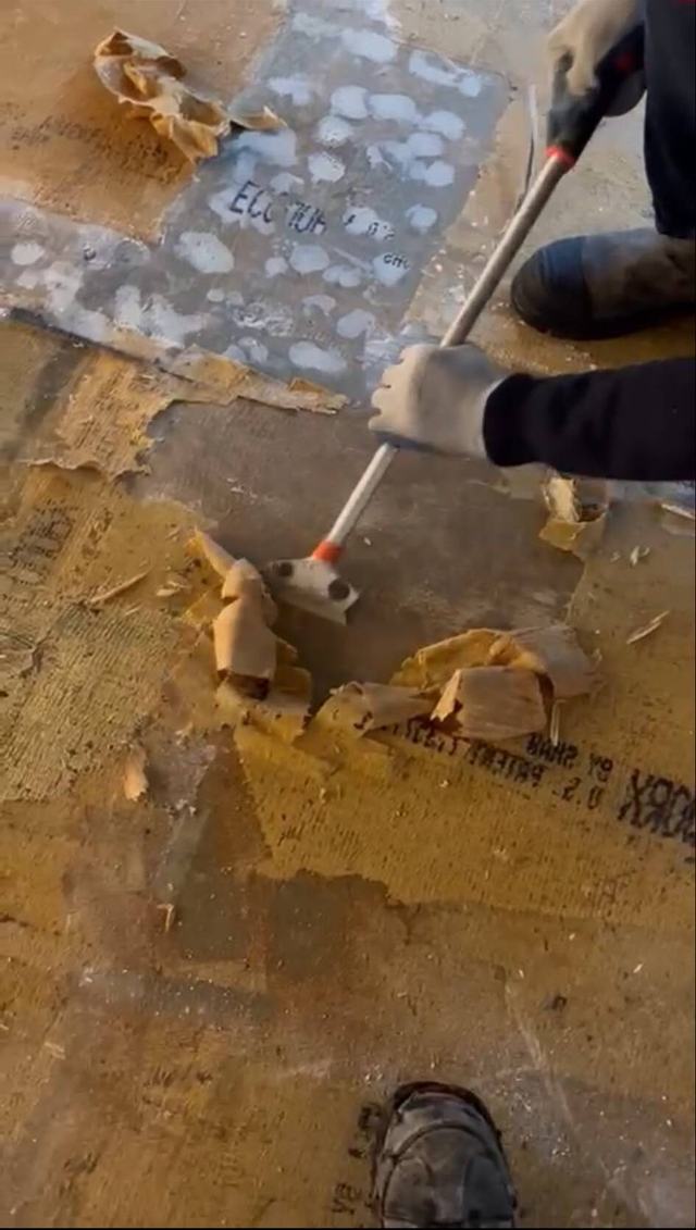 Scraping old flooring and adhesive off a slab