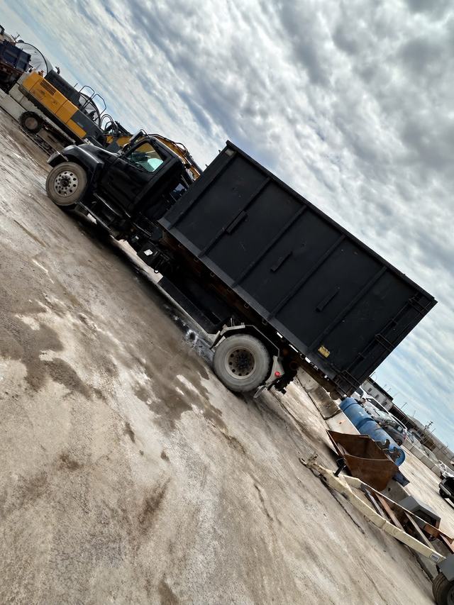 Bin truck at a transfer yard on a haul-away run